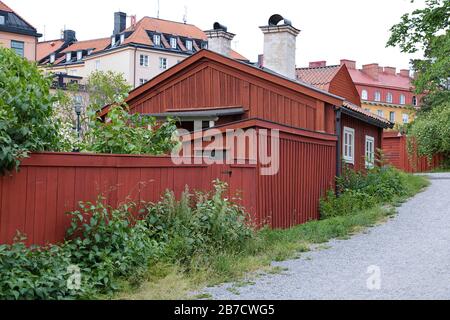 Traditional wooden houses painted in traditional red located in Stockholm, Sweden Stock Photo