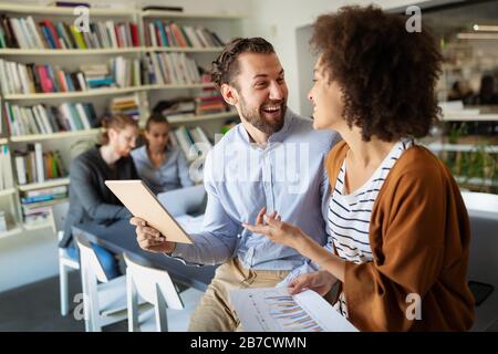 Portrait of business people, architects having discussion in office Stock Photo