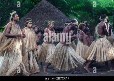 Melanesian indigenous yakel tribe of tanna island dancing traditional dance in grass closing Stock Photo