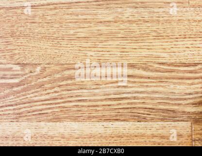 The texture of light linoleum floor close-up under the parquet. Stock Photo