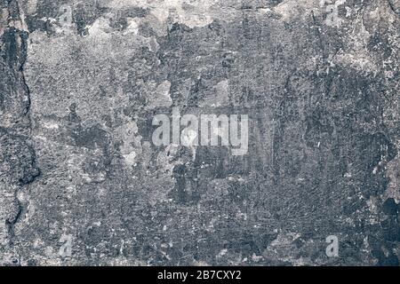 Old weathered and uneven stone wall texture background Stock Photo
