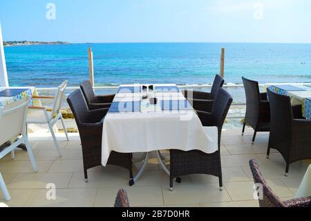 Restaurant on the coast of Hersonissos harbour with a sea view in Crete Stock Photo