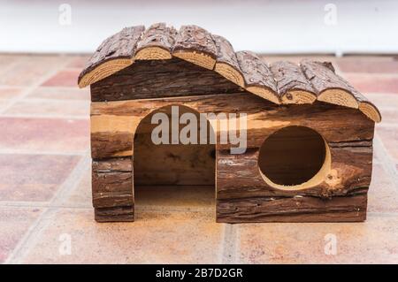 Wooden hamster house with door and window Stock Photo
