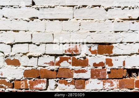 White brick deteriorated wall Stock Photo