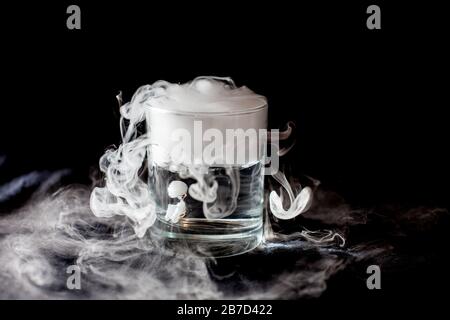 Chemical reaction of dry ice with liquid Stock Photo