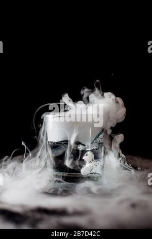 Chemical reaction of dry ice with liquid Stock Photo