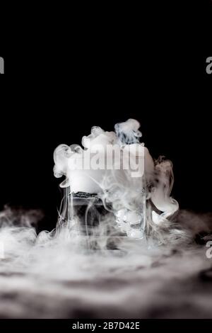 Chemical reaction of dry ice with liquid Stock Photo