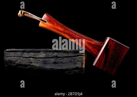 Mallet hammer wood made of rosewood tool handmade of Thailand for used by a carpenter in the workshop on isolated white background Stock Photo