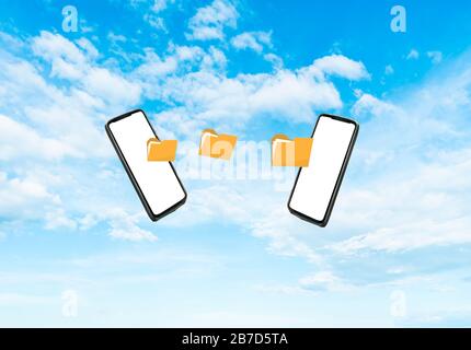 transfer from phone to phone. Sky in the background. Stock Photo