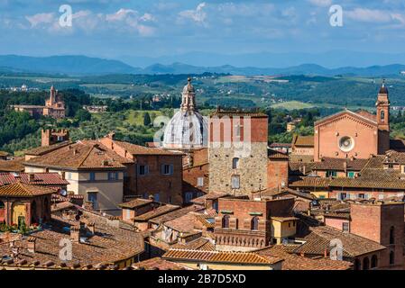 Chiesa di Santa Maria in Provenzano and Basilica di San Francesco seen from the Facciatone viewing terrace in Piazza del Duomo, Siena, Tuscany, Italy. Stock Photo