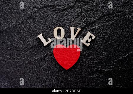 red hearts on black. concept of valentine day, love, wedding. Stock Photo