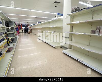 Sheerness, Kent, UK. 15th Mar, 2020. Vast empty shelves in Tesco Sheerness - almost the entire aisle where the toilet rolls are usually located - due to coronavirus panic buying. Credit: James Bell/Alamy Live News Stock Photo