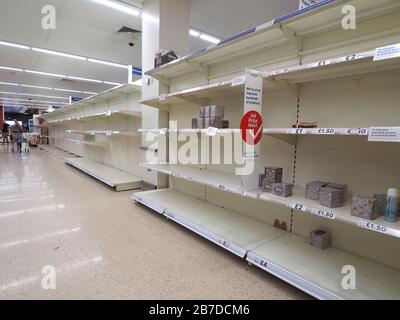 Sheerness, Kent, UK. 15th Mar, 2020. Vast empty shelves in Tesco Sheerness - almost the entire aisle where the toilet rolls are usually located - due to coronavirus panic buying. Credit: James Bell/Alamy Live News Stock Photo