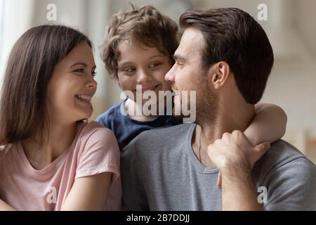 Happy family with little kid cuddle showing love Stock Photo