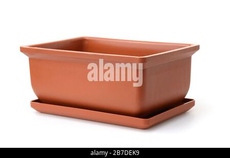 Brown empty rectangular plastic flower pot isolated on white Stock Photo