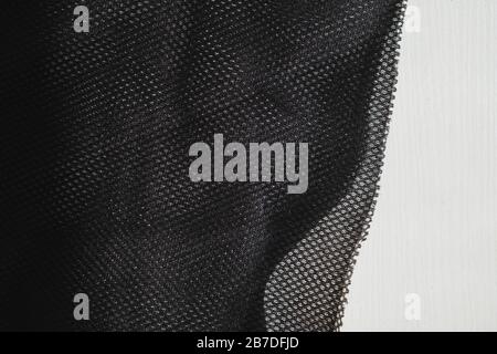 Meshy fabric in white backdrop. Detailed top view of cloth texture Stock Photo