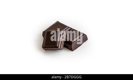 Three dark chocolate pieces. Concept: bakery, shops, candies shops Stock Photo