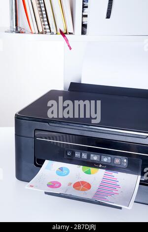 Printer and paper isolated on a white home table Stock Photo