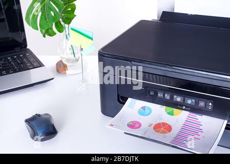Printer and paper isolated on a white home table Stock Photo