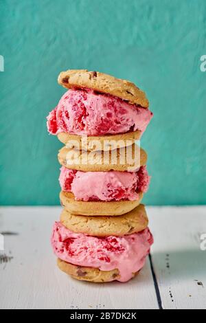 Close-up image of three raspberry ice cream sandwiches with chocolate chip cookies Stock Photo