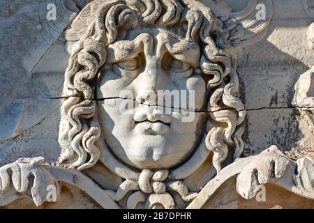 Antique relief representing head of Medusa, in the ruins of the Temple of Apollo in Didyma, Aydin, Turkey Stock Photo