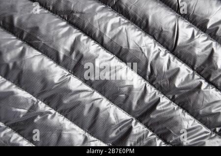 Background and texture of black autumn clothes made of bologna, up of clothes. Stitches on the fabric. Stock Photo
