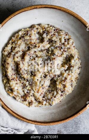A healthy multigrain porridge in a ceramic bowl Stock Photo