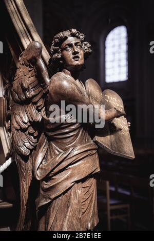 Wooden Evangelist Statue as a Pulpit decoration inside a church in Grimbergen Belgium by Flemish sculptor Hendrik Frans Verbruggen (1654-1724) Stock Photo