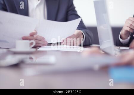 Close-up of business partners hands holding document papers , business meeting negotiation concept Stock Photo