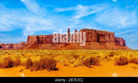 Three Sisters and Mitchell Mesa, a few of the many Red Sandstone Buttes and Mesas in Monument Valley a Navajo Tribal Park at Utah and Arizona border Stock Photo