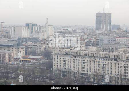 Bucharest, Romania - March 03, 2020: Overview of Bucharest as seen from the Palace of Parliament on a cloudy day. Stock Photo