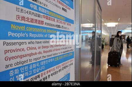 Tokyo, Japan. 15th Mar, 2020. A notice from the Ministry of Health, Labor and Welfare is seen at Tokyo International Airport (Haneda Airport) in Tokyo, Japan on Sunday, March 15, 2020. Tourism has decreased due to the effects of coronavirus in Japan. Photo by Keizo Mori/UPI Credit: UPI/Alamy Live News Stock Photo