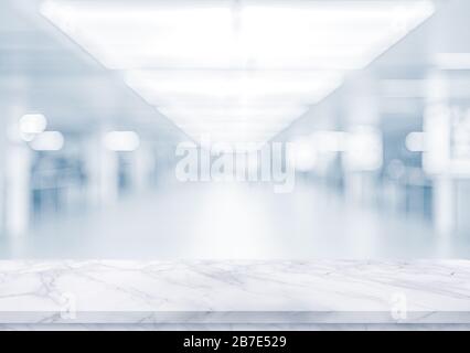 White marble texture  table top on  BLURRED OFFICE BACKGROUND Stock Photo