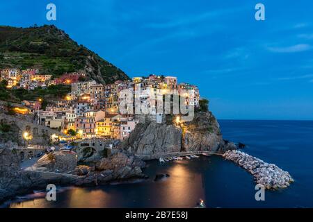 Manarola as one of the Cinque Terre villages during the blue hour with lights Stock Photo