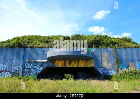 Battery Harris East, an old abandoned massive concrete casemate, which dates back to 1941, is now covered with graffiti, on August 11th, 2019 in Queen Stock Photo