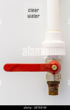 Exterior rusty tap isolated on white wall background Stock Photo