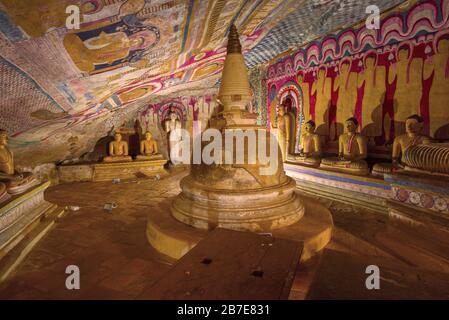 Buddhist stupa in the interior of ancient cave Buddhist temple. Dambulla, Sri Lanka Stock Photo