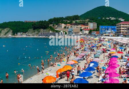 Crowds of bathers on the beach at Black Sea. Olginka. Krasnodar Krai, Russia. Stock Photo