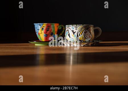 Two Tea and coffee Cups and plates different colour Stock Photo