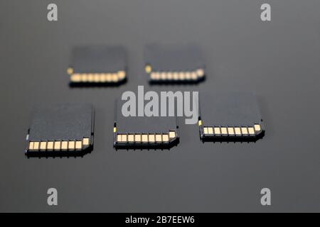 SD memory cards on black glass surface, selective focus. Data storage concept Stock Photo