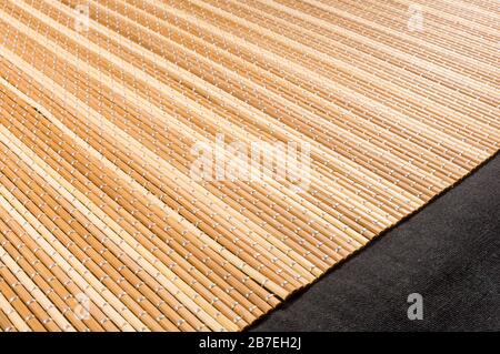 brown bamboo Mat - stand food, close-up, macro, black background Stock Photo