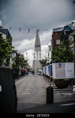 A vertical shot of the Hallgrimskirkja church against the blue sky in ...