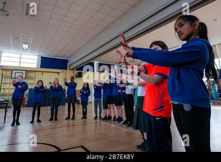 School pupils doing meditation exercise, Davidsons Mains primary school, Edinburgh, Scotland, UK Stock Photo