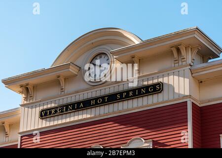 Hot Springs, Va historic downtown town city in Virginia countryside with closeup of sign clock time on building Stock Photo