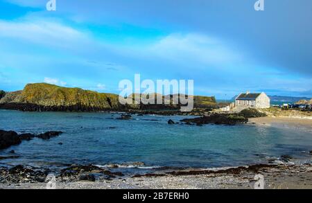 Ballintoy is a small village on the Antrim Coast. It's rocky coastline is open to the wild Atlantic Ocean. Popular with tourist mainly due to its uses Stock Photo