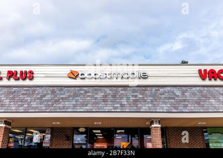 Herndon, USA - November 12, 2019: Exterior of Boost Mobile store on street in Virginia Fairfax County with sign and entrance Stock Photo