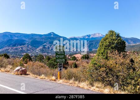 Colorado Springs, USA - October 13, 2019: View from the Garden of the Gods in Colorado with sign on road for visitor center and parking lot Stock Photo