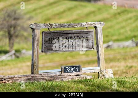 Blue Grass, USA - October 18, 2019: Closeup of rustic entrance sign for farm called High Meadow Cragnolin near Monterey in Highland County, Virginia Stock Photo