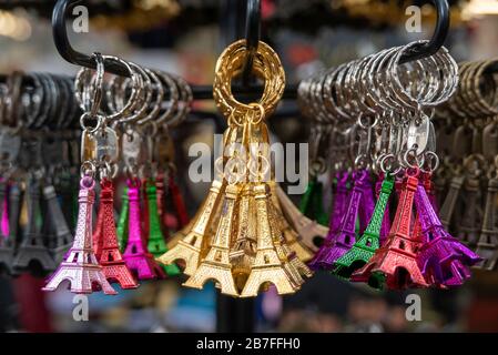 Colorful miniature Eiffel Tower metallic key-chains Paris souvenirs for sale Stock Photo