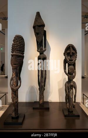 Wooden african sculptures on display at the Louvre Museum in Paris, France, Europe